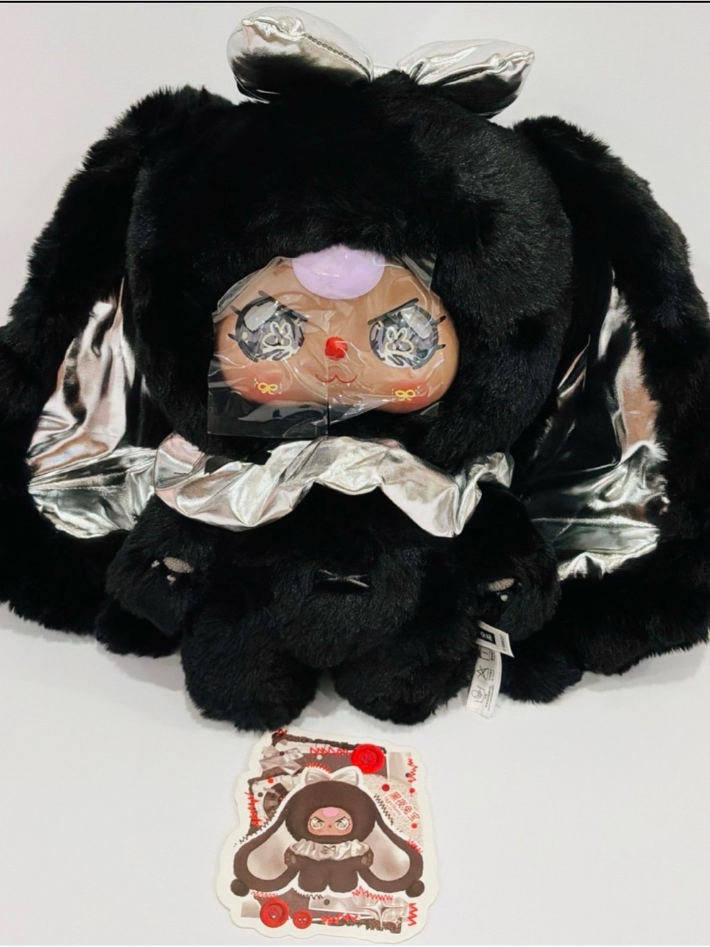 Plush Black Bunny Character Toy with Silver Accents
